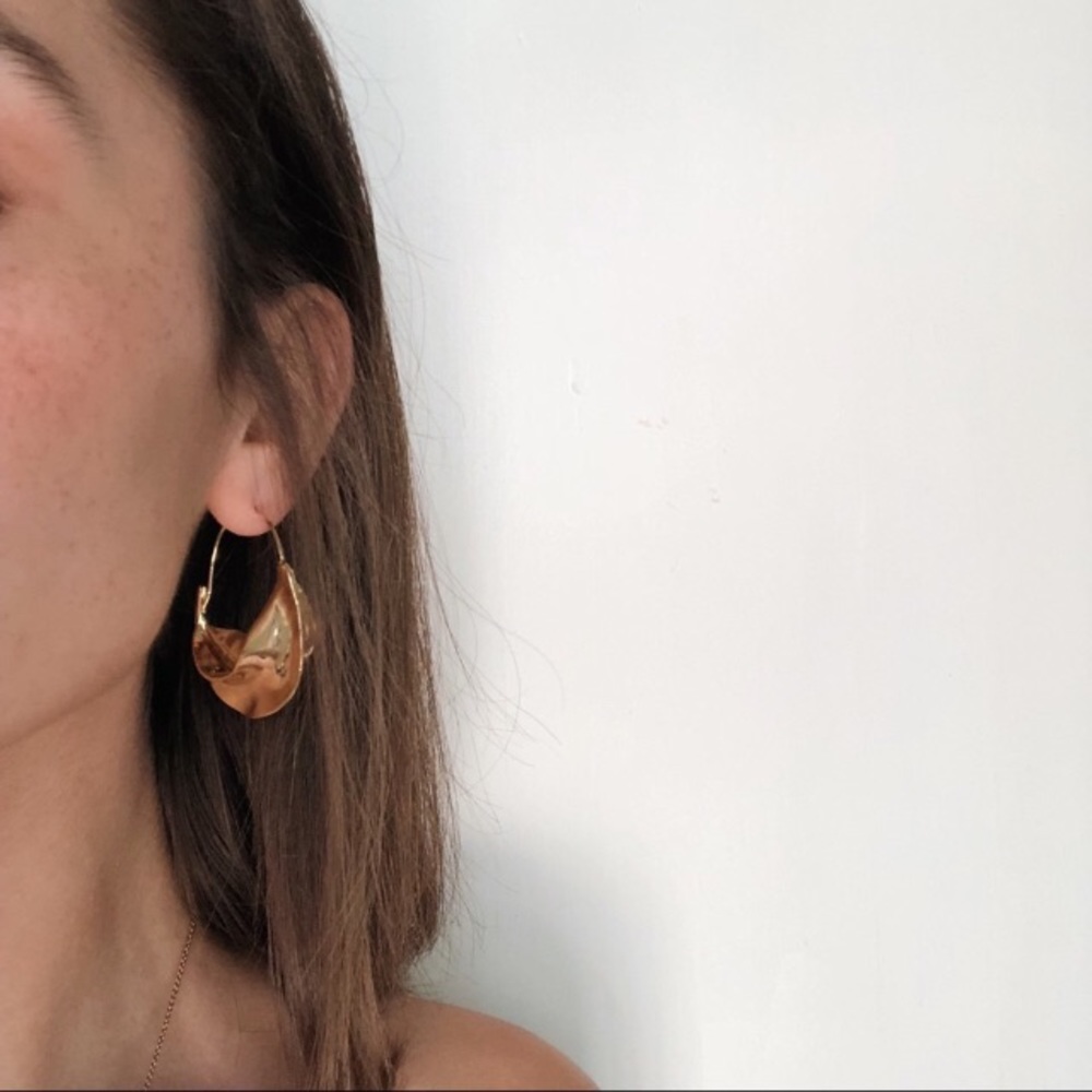 Abstract molten gold hoops
